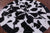 Black & White Round Star Natural Cowhide Hand Stitched Rug - Manhattan Rugs