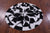 Black & White Round Natural Cowhide Hand Stitched Rug - Manhattan Rugs