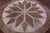 Brown Round Natural Cowhide Hand Stitched Rug - Manhattan Rugs