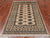 Beige 4' 1" X 6' 1" Silky Bokhara Handmade Wool Rug - Q24575