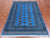 Blue 4' 6" X 6' 11" Silky Bokhara Hand-Knotted Wool Rug - Q24600