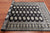 Black 4' 8" X 6' 11" Silky Bokhara Handmade Wool Rug - Q24612