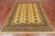 Gold 5' 7" X 7' 10" Silky Bokhara Handmade Wool Rug - Q24663