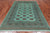 Green 5' 8" X 8' 1" Silky Bokhara Handmade Wool Rug - Q24664