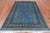 Blue 5' 6" X 7' 10" Silky Bokhara Hand-Knotted Wool Rug - Q24672