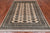 Ivory 5' 6" X 7' 10" Silky Bokhara Hand-Knotted Wool Rug - Q24673