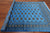 Blue 6' 1" X 8' 11" Silky Bokhara Hand-Knotted Wool Rug - Q24677