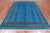 Blue 6' 0" X 8' 7" Silky Bokhara Hand-Knotted Wool Rug - Q24683