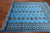 Blue 6' 1" X 8' 4" Silky Bokhara Hand-Knotted Wool Rug - Q24699