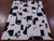 Black & White Natural Cowhide Hand Stitched Rug - Manhattan Rugs